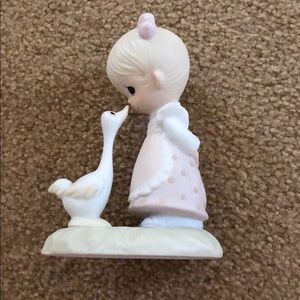 Cute girl and duck figurine